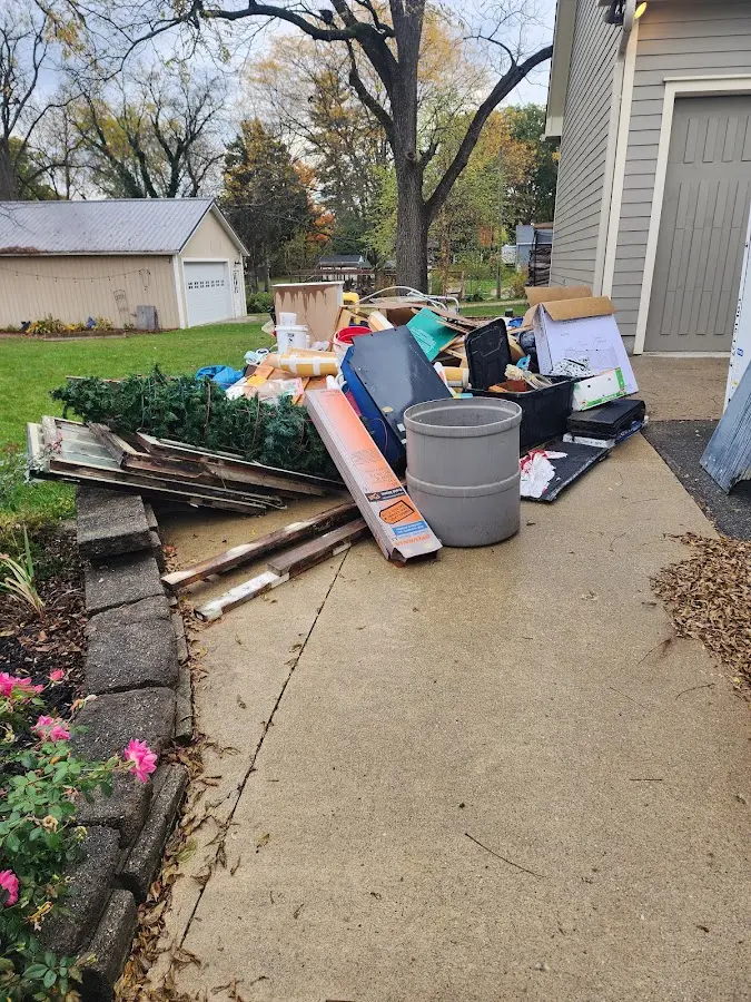Dumpster being loaded with debris for 3 Yard Dumpster Rental in Cookeville